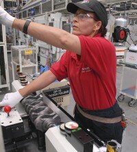 Heidi Latschrauner, one of Toyota’s production team members, works on the automated machining lines at Toyota’s engine manufacturing plant in Deeside, North Wales